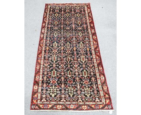 A PERSIAN MAHAL RUNNER, the dark blue field with all-over linking design enclosed within a narrow guard stripe and meandering