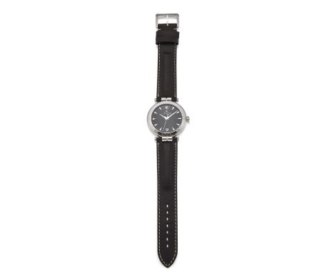 A GENTS STEEL MICHEL HERBELIN NEWPORT STRAP WATCH. Circular black dial with silver baton index and hands, date aperture at 6 