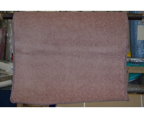 Tufted light pink rug, 67 x 120cm