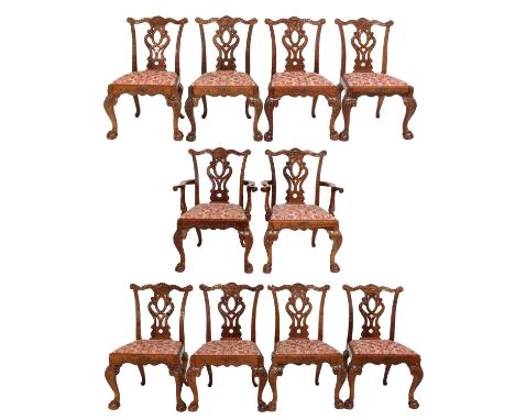 A Set of Ten (8+2) Carved Mahogany Chippendale-Style Dining Chairs, 20th century, covered in pink and cream floral fabric, th