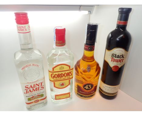 Bottle of Gordons gin St James white rum 43 liqueur and a Black Tower