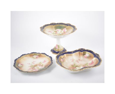 Austrian porcelain nine-piece dessert service, painted with floral sprays within cobalt blue and gilt borders, including one 