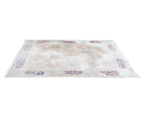 Kirman carpet, tiled floral field, within formal borders with signature panels, 381cm x 269cm, (worn).