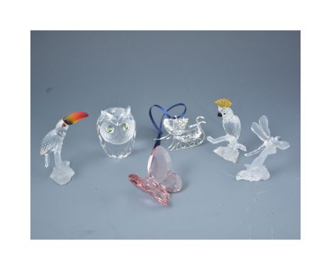Collection of boxed Swarovski Crystal cut and faceted glass ornaments, including: Light Amethyst butterfly, Dragonfly on stan