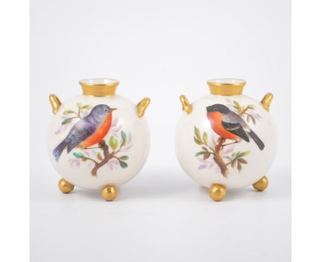 Pair of Worcester spherical vases, each with twin handles raised on three ball feet, each hand-painted with garden birds, 9cm