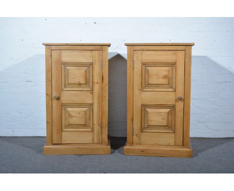 Pair of contemporary pine cupboards, panel doors enclosing single shelf on plinth bases, W58cm x D45cm x H96cm.