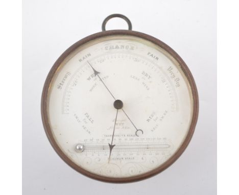 Lacquered brass drum cased aneroid barometer, with horizontal fahrenheit scale, diameter 12cm.