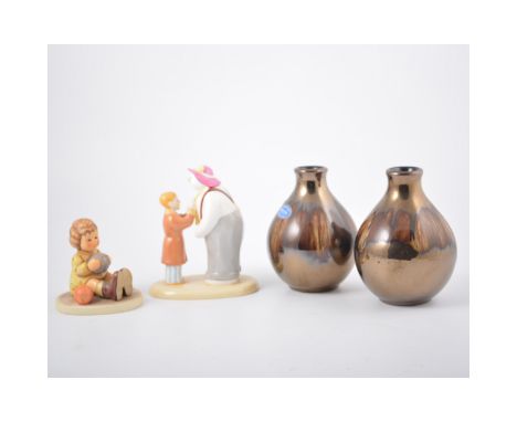 Two Poole Pottery lustred bud vases, 13cm; Coalport Snowman group, Hummel figure, etc (7)