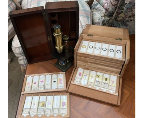 A brass monocular microscope, cased together with a box of slides