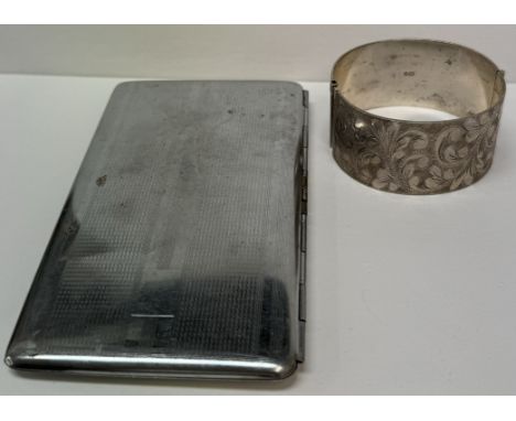 A silver hinged bangle together with a plated cigarette case