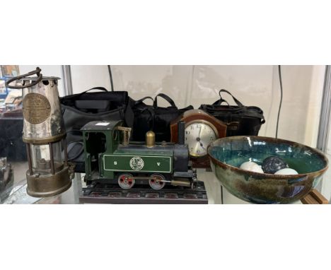 A Napoleon hat clock, together with a miners lamp, steam locomotive, binoculars, pottery bowl and hardstone eggs