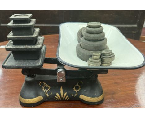 A kitchen scales with assorted weights