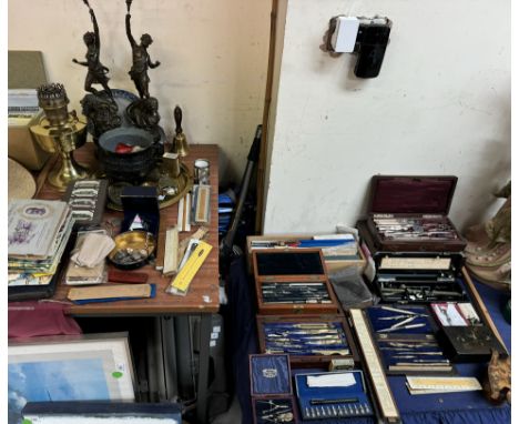 A pair of spelter figures together with a brass oil lamp, cigarette cards, brasswares and a collection of draughtsmens sets, 