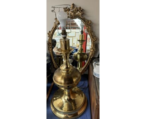 A gilt framed wall mirror together with a large brass table lamp