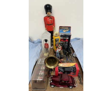A Windsor Guardman decanter, together with other figures, bugle, coronation coach etc