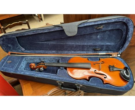 A Boosey & Hawkes Ltd violin with a one piece back and ebonised inlaid stringing, back 36.5cm long not including button, 60cm
