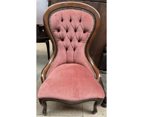 A Victorian style spoon back nursing chair with pink button back upholstery on shaped legs