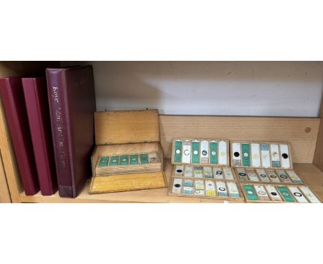 Three albums of first day covers and a box of microscope slides
