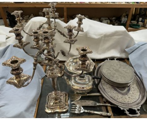 A pair of four branch electroplated candelabra together with an electroplated twin handled tray, teapot, fish servers, teapot