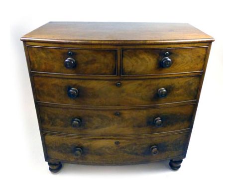 A Victorian mahogany bow fronted chest of drawers two short over three graduated drawers with turned knobs on turned legs. h.