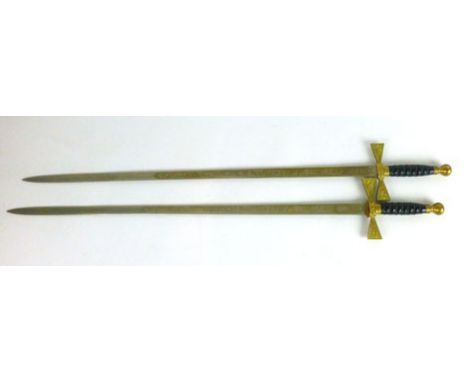 A pair of reproduction wall hanging Wilkinson swords, with strung handle and a decorated blade, blade length 76.5 cm 