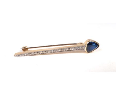A yellow gold and platinum highlighted bar brooch of arrow shaped form, the head set triangular cut sapphire above a diamond 
