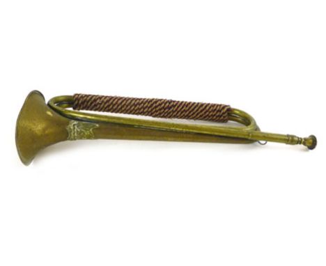 An early 20th century brass bugle marked with the Ayrshire Yeomanry crest, with red white and blue binding l. 45cm 