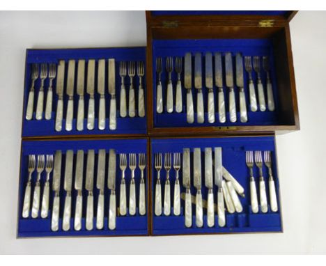 An oak cased set of twenty four pairs of  silver hallmarked dessert knives and forks with mother of pearl handles monogrammed