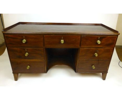 A George III and later mahogany and boxwood line inlaid sideboard, the galleried and moulded top over three long drawers abov