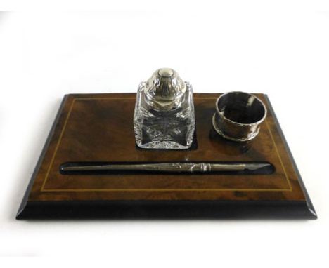 A modern desk stand comprising of a silver hallmarked cut glass inkwell together with a silver hallmarked quill pen dated Bir