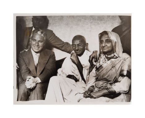 Gandhi, Mohandas Karamchand - with Charlie Chaplin Press Photograph, 1931 Silver gelatin print showing Gandhi and Chaplin at 