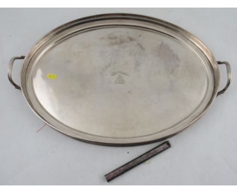 An oval silver plated tray, together with a Dunhill lighter, engraved with measurements