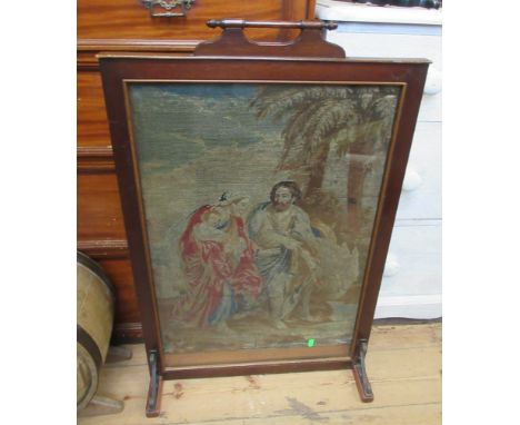 A mahogany fire screen, with tapestry panel