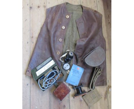A leather waistcoat, together with a set of Brandes Superior BBC headphones, an Army Signals book etc