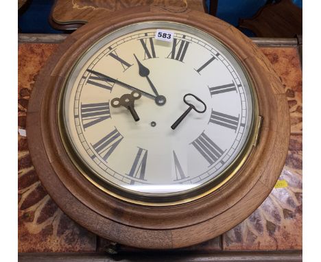 Round wall clock with key