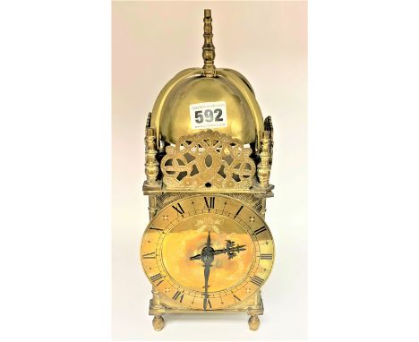 Brass lantern clock with key. 12.5” high