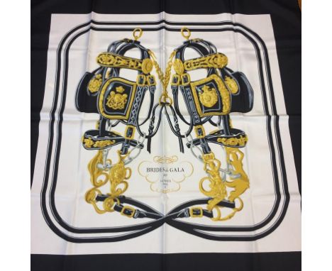 A black ground silk Hermes scarf