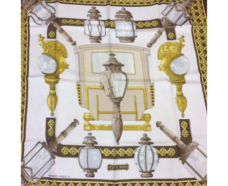 A brown ground silk Hermes scarf
