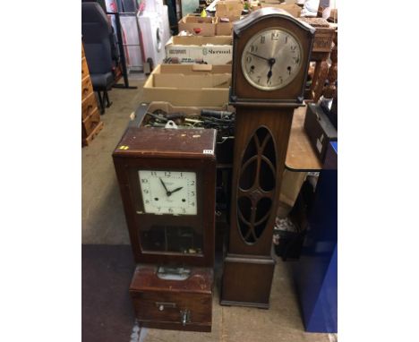 A clocking in clock and a Granddaughter clock