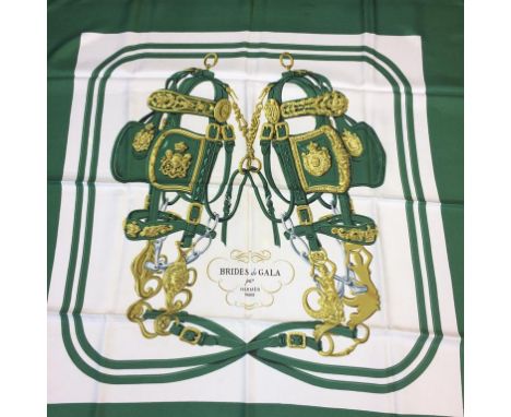 A green ground silk Hermes scarf