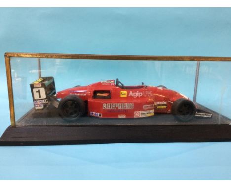 A cased model racing car, Case 59cm wide x 25.5cm deep x 18cm high (excluding plinth)