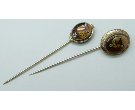 Two gilt metal stick pins with fox detail, largest top 2.1 x 1.8cm, both in fitted jewellery box