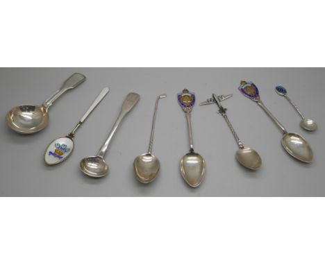 A collection of silver spoons including enamelled examples, a Georgian caddy spoon, another Georgian spoon, a .800 silver aer