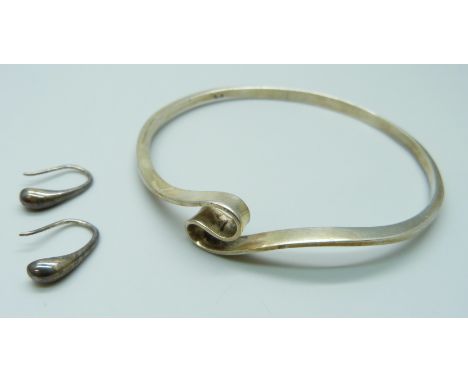 A silver bangle, 17g, and a pair of silver earrings