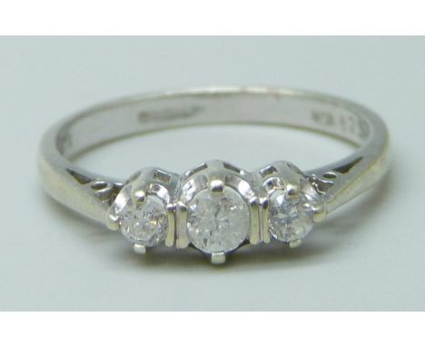 A 9ct white gold and three stone diamond ring, 1.7g, K/L