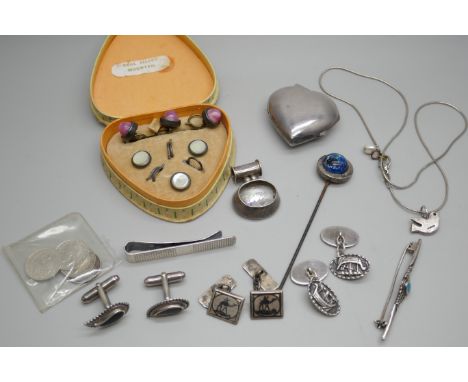 A silver heart shaped locket, a silver pendant set with a white stone, a silver tie bar, two pairs of silver cufflinks, four 