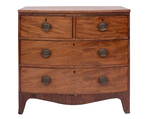 A late George III mahogany bowfront chest of drawers, circa 1800; the top with reeded edges, above two short and two long dra