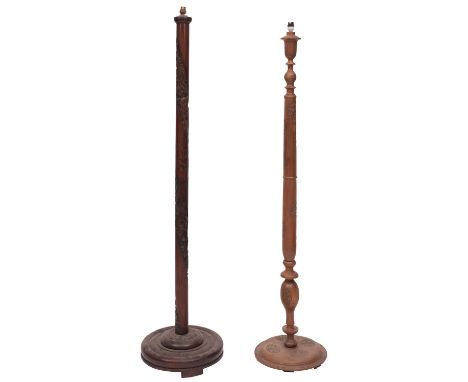 A Japanese Meiji carved hardwood standard lamp, circa 1900 and later; the electrical fitment above a shaft with stylised drag