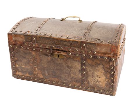 A George III pony hide and studded leather travelling trunk, late 18th century; the domed and hinged cover with brass swing h