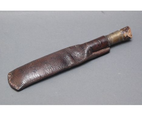 Leather shot flask with brass top and cork stopper.  Length excluding stopper 22 cm. 